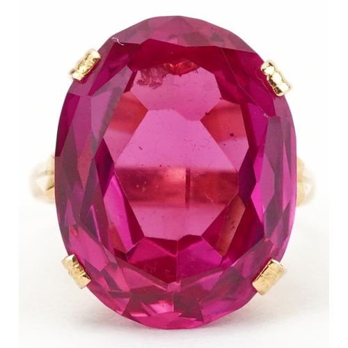 2201 - Chinese 22K gold ruby ring with openwork setting, character marks around the band, the ruby approxim... 