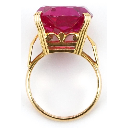 2201 - Chinese 22K gold ruby ring with openwork setting, character marks around the band, the ruby approxim... 