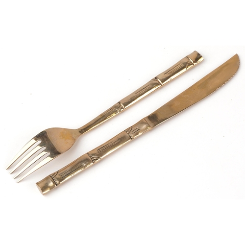 732 - Thai twelve place canteen of bronze cutlery with simulated bamboo handles, the canteen 46cm wide