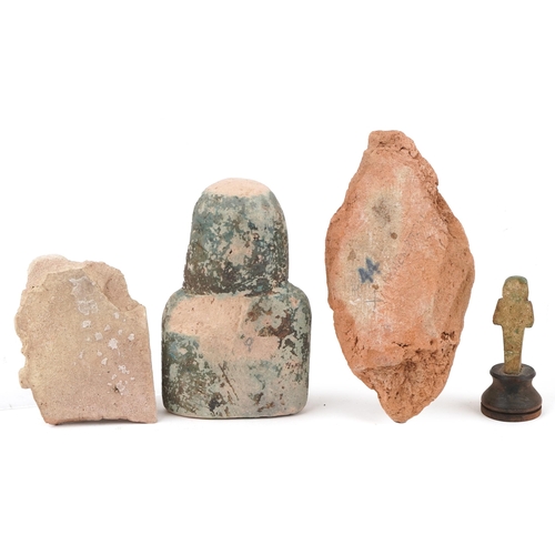 357 - Four Egyptian artefacts including a blue faienced shabti bust and a carving of Achnaton, two inscrib... 