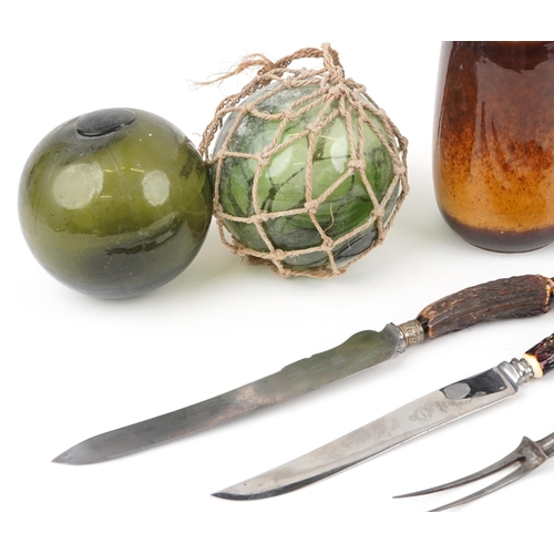 1365 - Sundry items including carving knives and two antique green glass floats, the largest 45cm in length