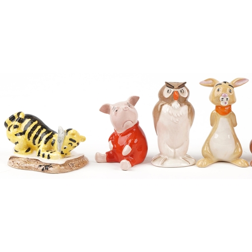 686 - Seven Beswick and Royal Doulton Disney Winne the Pooh characters including Winnie the Pooh, Tigger a... 