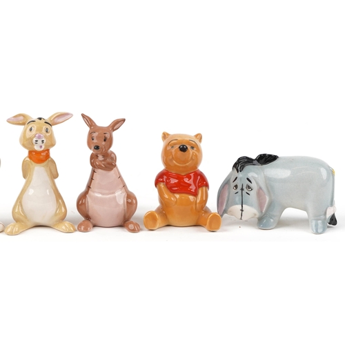 686 - Seven Beswick and Royal Doulton Disney Winne the Pooh characters including Winnie the Pooh, Tigger a... 