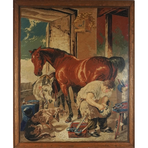 1370A - Farrier shoeing a horse with donkey and gundog, 19th century needlework tapestry, framed and glazed,... 