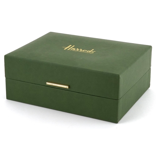 743 - Pair of Harrods crystal glasses housed in a fitted box, each glass 8cm high