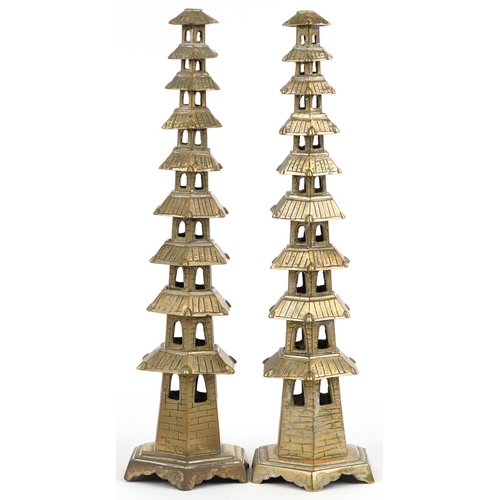 624 - Pair of Chinese brass or bronze incense burners in the form of pagodas, 34cm high