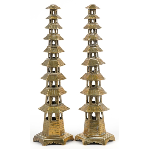 624 - Pair of Chinese brass or bronze incense burners in the form of pagodas, 34cm high