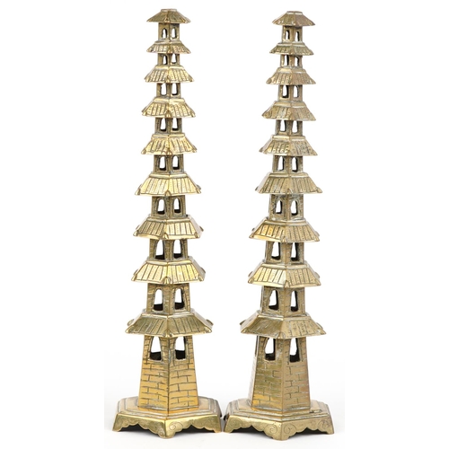 624 - Pair of Chinese brass or bronze incense burners in the form of pagodas, 34cm high