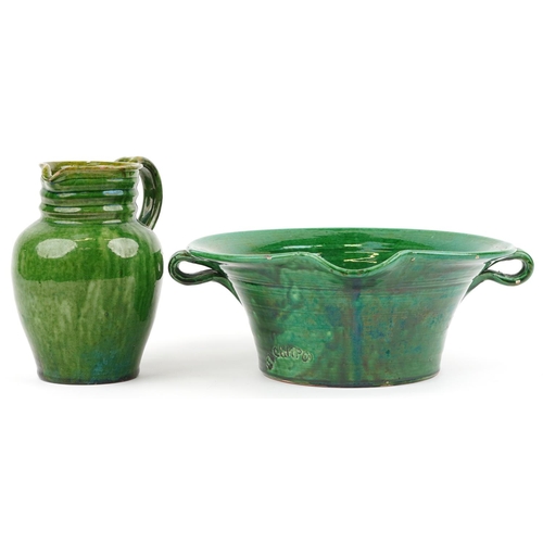 1325 - Continental green glazed pottery twin handled vessel impressed El Campo and a similar jug, 37cm wide