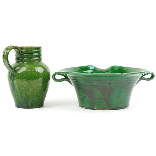 1325 - Continental green glazed pottery twin handled vessel impressed El Campo and a similar jug, 37cm wide