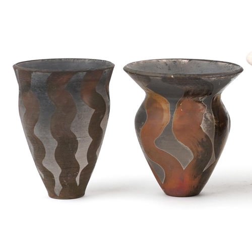 108 - Contemporary raku glazed studio pottery including a centre bowl and two vases having an abstract des... 