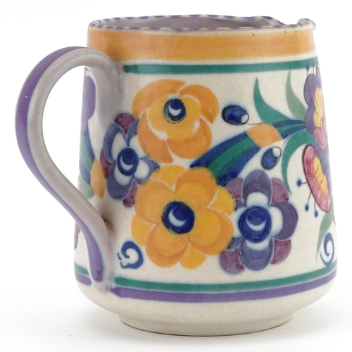 582 - Early 20th century Poole Carter, Stabler & Adams jug hand painted with stylised flowers, incised 319... 