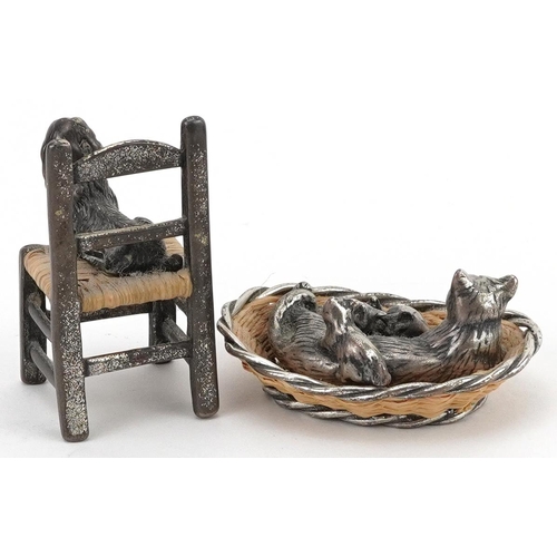 306 - Two miniature silver and wicker animals comprising cat in a basket with kittens and a dog seated on ... 