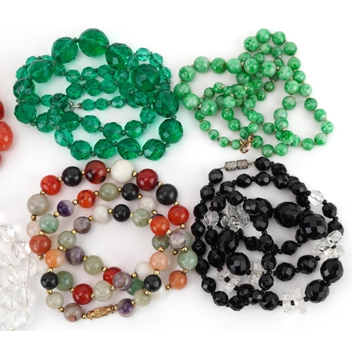 2799 - Eight crystal and semi precious stone necklaces including amethyst, carnelian and jade, the largest ... 