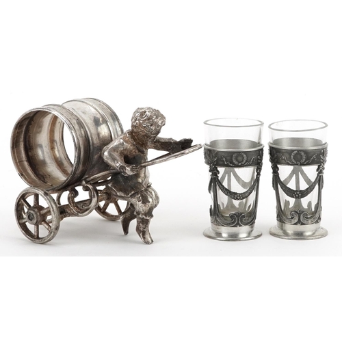 1531 - Silver plated napkin holder in the form of a boy pulling a cart and a pair of pewter and glass lique... 