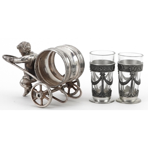 1531 - Silver plated napkin holder in the form of a boy pulling a cart and a pair of pewter and glass lique... 