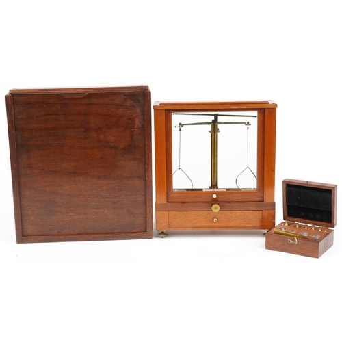 497 - Becker Bros of New York, mahogany cased balance scales with mahogany travel case and set of brass an... 