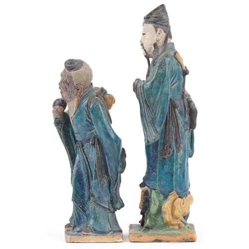 346 - Pair of Chinese porcelain figures having sancai type glazes including one of an elder holding a frui... 