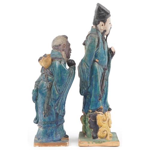 346 - Pair of Chinese porcelain figures having sancai type glazes including one of an elder holding a frui... 