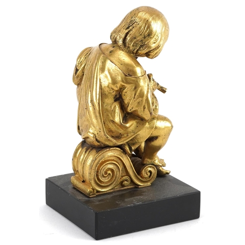 94 - 19th century gilt bronze statuette of a young musician playing an instrument, raised on a rectangula... 