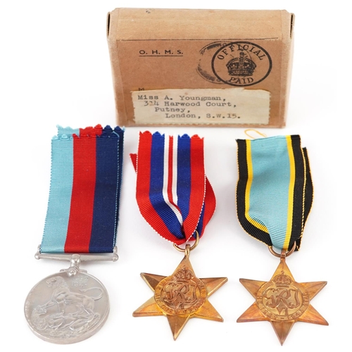 Three British military World War II medals with box of issue including Air Crew Europe star, the box with label printed Miss A Youngman, 314 Harwood Court, Putney, London