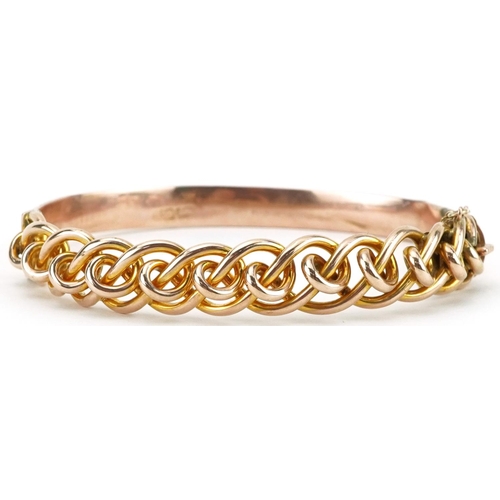 2224 - 9ct rose gold openwork hinged bangle, 7cm wide, 13.7g