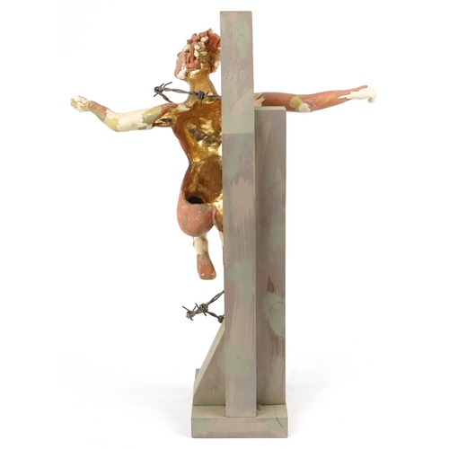 245 - Neil Wilkinson, contemporary Brutalist painted resin sculpture of a nude female on hardwood cross wi... 