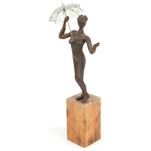 392 - Neil Wilkinson, contemporary Brutalist cast resin sculpture of a nude female holding an umbrella rai... 