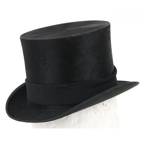 1299 - Dunn & Co of London moleskin top hat with box, size 7