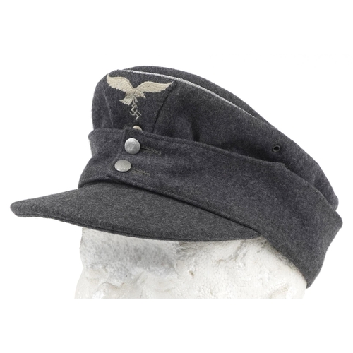 1885 - German military interest M44 junior officer's ski cap with cloth badge, stamped and dated 1944 to th... 