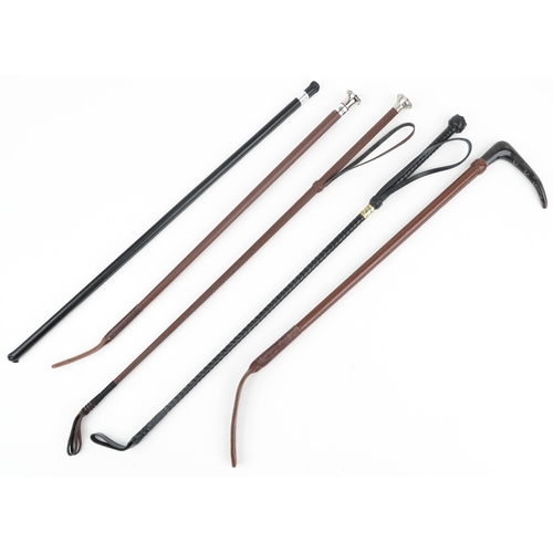 1368 - Five leather riding crops including one with horn handle, the largest 67cm high