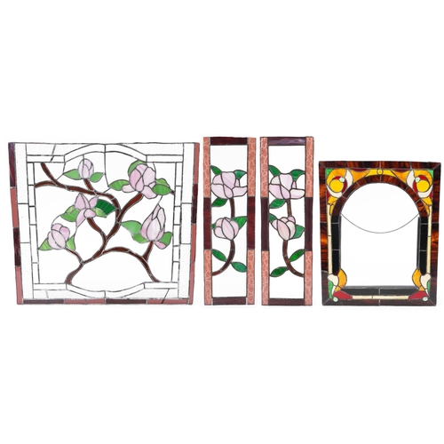 1384 - Four leaded stained glass window panels including a pair, each decorated with flowers, the largest 6... 