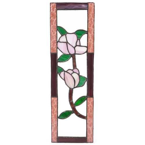 1384 - Four leaded stained glass window panels including a pair, each decorated with flowers, the largest 6... 