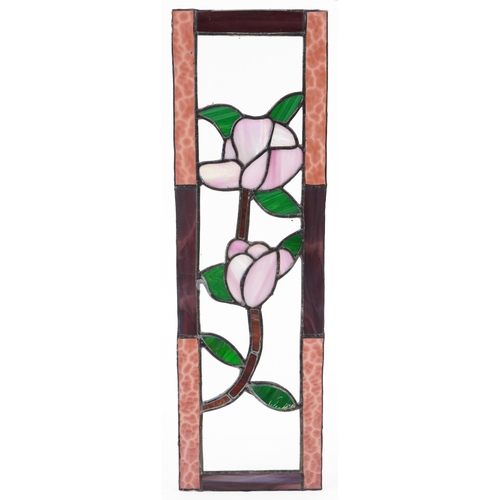 1384 - Four leaded stained glass window panels including a pair, each decorated with flowers, the largest 6... 