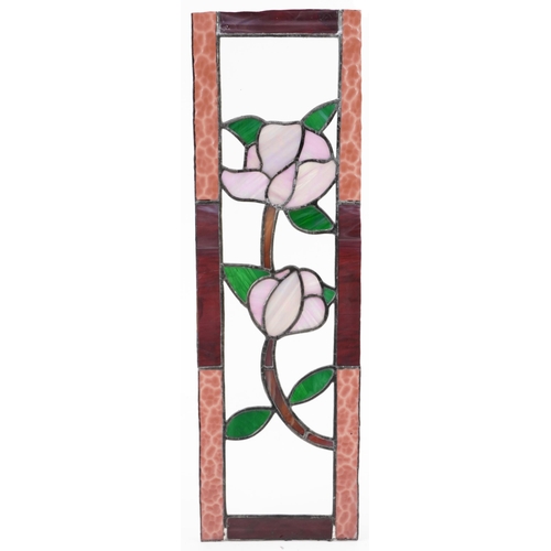 1384 - Four leaded stained glass window panels including a pair, each decorated with flowers, the largest 6... 