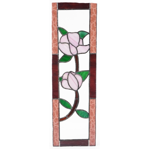 1384 - Four leaded stained glass window panels including a pair, each decorated with flowers, the largest 6... 