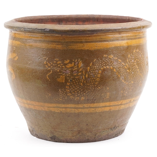 1107 - Large Chinese archaic style terracotta planter having and ash and brown glaze, incised with two drag... 