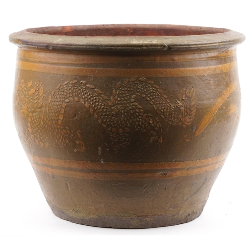 1107 - Large Chinese archaic style terracotta planter having and ash and brown glaze, incised with two drag... 