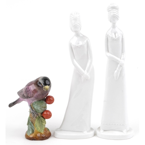 1286 - Two Spode figurines and a Spode hand painted porcelain finch, the largest 27.5cm high