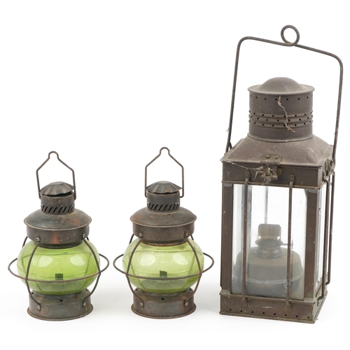204 - Three shipping interest hanging lanterns including a pair with green glass, the largest 47cm high