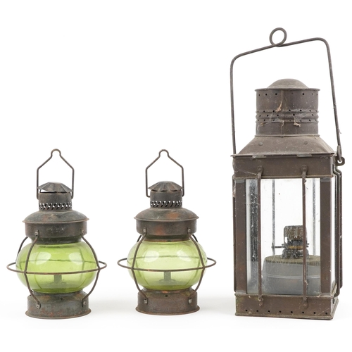 204 - Three shipping interest hanging lanterns including a pair with green glass, the largest 47cm high