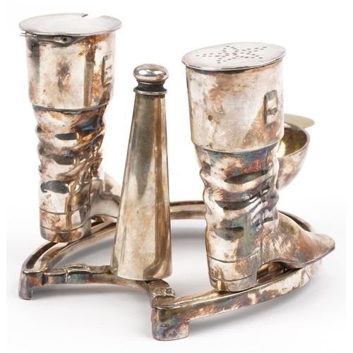 147 - Elkington & Co, equestrian interest silver plated cruet set in the form of a horseshoe, riding boots... 