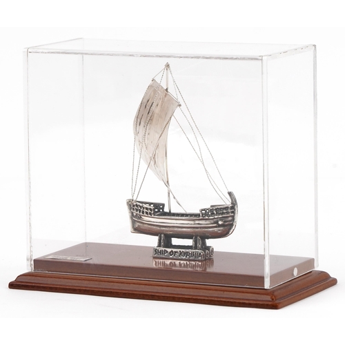 494 - 950 grade silver model of The Ship of Kyrenia housed in a display case, overall 14.5cm high, weighab... 