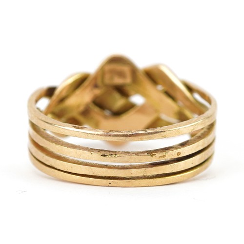 2749 - 18ct gold four section puzzle ring, size J, 6.0g