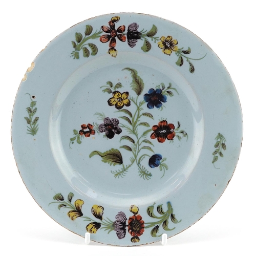 1484 - 19th century continental faience glazed plate hand painted with flowers, 18cm in diameter