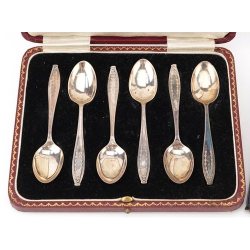 123 - Two sets of six silver teaspoons with fitted cases including a set by Mappin & Webb, each 11cm in le... 