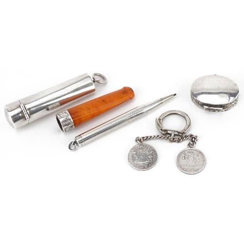 121 - Edwardian and later silver objects including a butterscotch amber coloured cheroot holder with silve... 