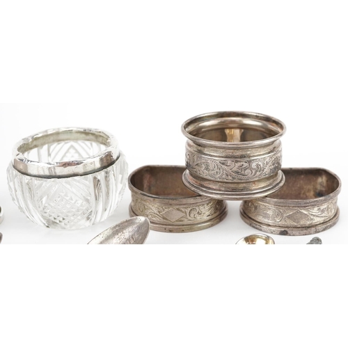 446 - Edwardian and later silver objects including a buttonhole napkin clip, napkin rings, teaspoons and m... 