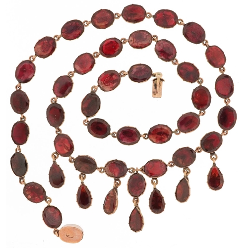 2223 - 19th century rose gold oval garnet fringe necklace with closed foil backs, the clasp stamped 9KT, 42... 