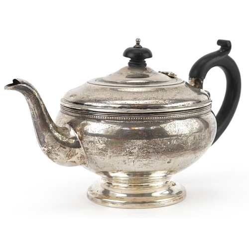 69 - G Bryan & Co, George V silver teapot with ebonised wood handle and knop, Birmingham 1932, 24cm in le... 